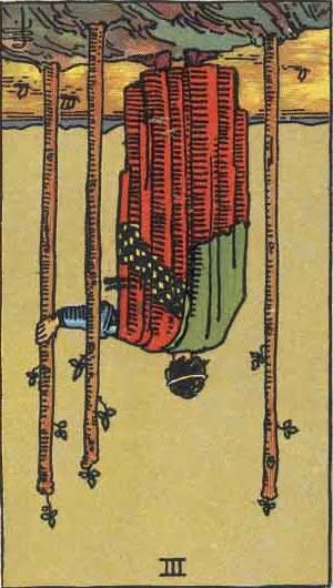 The reverse three of wands depicts failure and self-doubt.